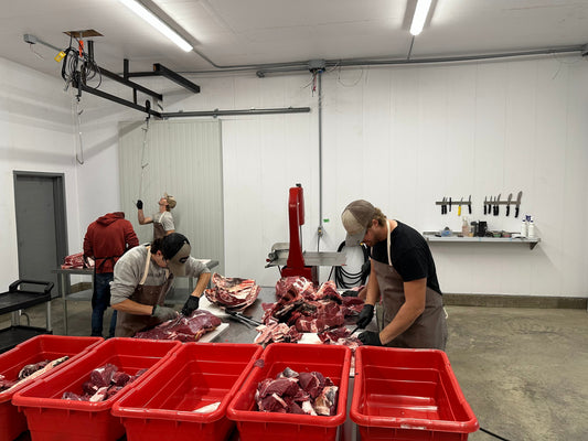 butchers cutting red meat